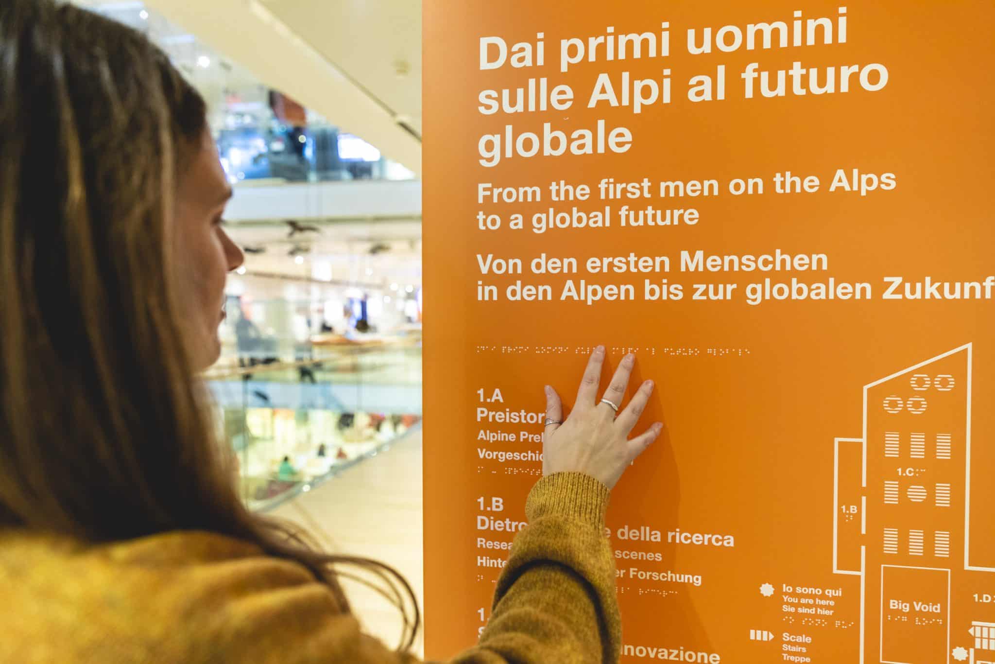 Young woman touching a tactile map